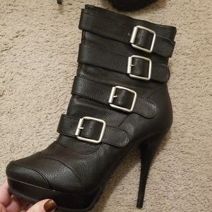 Black buckle high heel boots